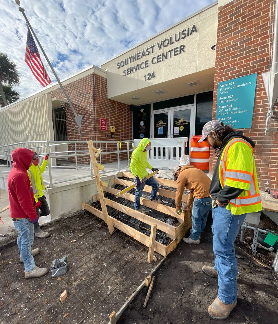 AT DBE crew forming concrete steps at the Southeast Volusia Service Center
