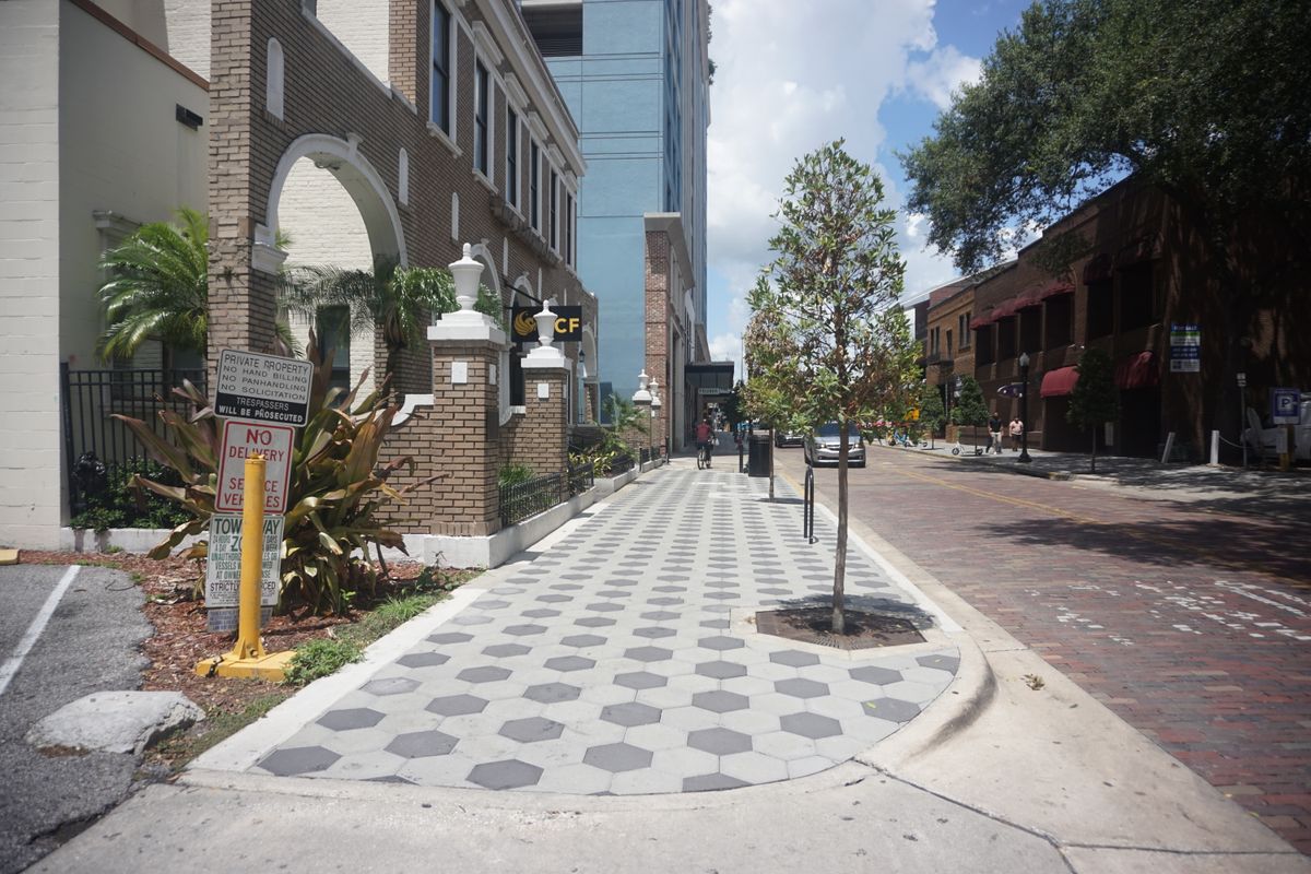 Hexagonal paver sidewalk installed by AT DBE on W Pine St in downtown Orlando